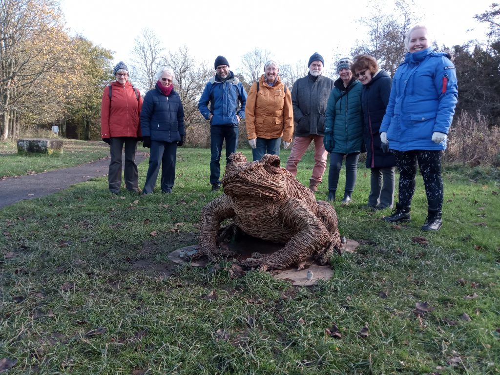 Walkers with Toad sculpture